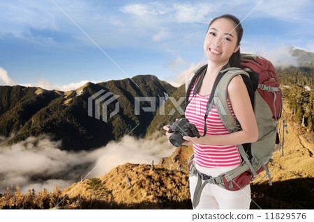 backpacker with camera backpacker with camera 11829576