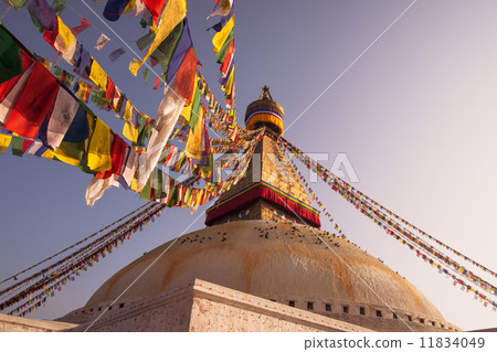Prayer flags and Boudhanath stupa in Kathmandu Prayer flags and Boudhanath stupa in Kathmandu 11834049