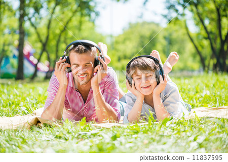 Father and son in park Father and son in park 11837595