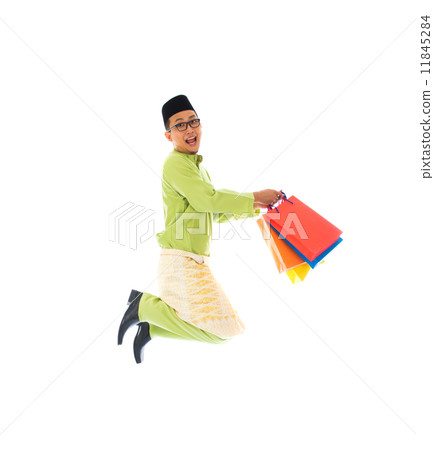 malay male with shopping bags during festival season 11845284
