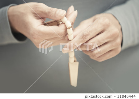 Hands with rosary beads 11846444