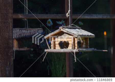 Handcrafted log cabin birdhouse. Close-up 11846869
