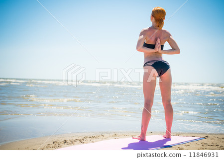 Woman doing yoga reverse namaste Woman doing yoga reverse namaste 11846931