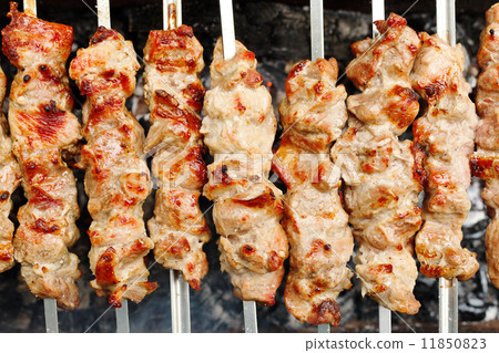 skewers with shish kebabs on brazier 11850823