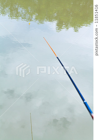 float floating in the calm river while fishing 11851416