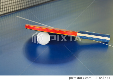 racket, tennis ball on blue ping pong table racket, tennis ball on blue ping pong table 11851544