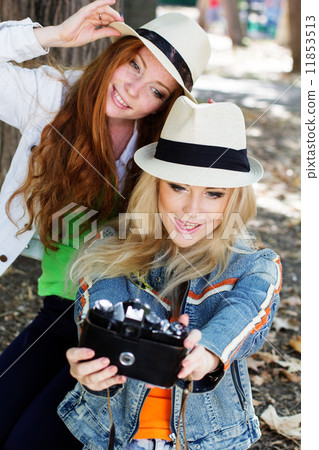 Two teenagers girl taking selfe with camera  11853513