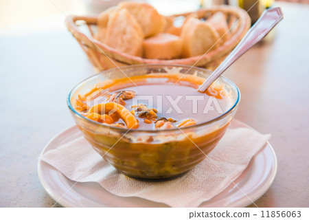 Bowl of fish soup close-up 11856063