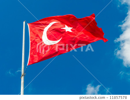 Waving flag of Turkey over blue sky background 11857578
