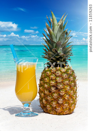 Pineapple fruit and juice on the beach Pineapple fruit and juice on the beach 11859263