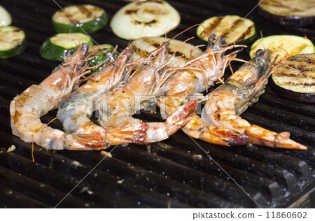 cooking shrimp kebabs on the grill in the restaurant cooking shrimp kebabs on the grill in the restaurant 11860602