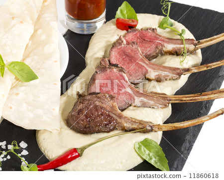 lamb ribs cooked on the grill served on a hot stone lamb ribs cooked on the grill served on a hot stone 11860618