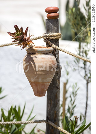 flower pots on a wooden post flower pots on a wooden post 11861040