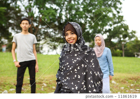 Three Asians in the park Three Asians in the park 11861619