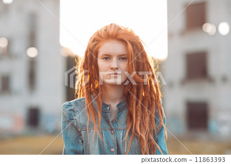 Young girl with dreadlocks outdoors 11863393