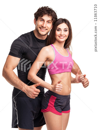 Athletic man and woman after fitness exercise with a finger up o Athletic man and woman after fitness exercise with a finger up o 11863710