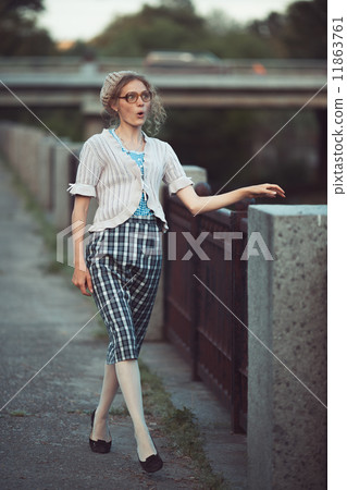Funny girl with glasses and a vintage dress 11863761
