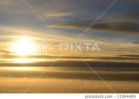 Sunset over the clouds 11864409