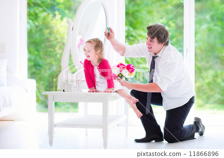 Father brushing his daughter hair Father brushing his daughter hair 11866896