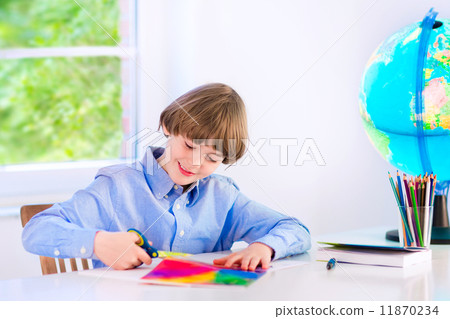 Smiling boy doing homework 11870234