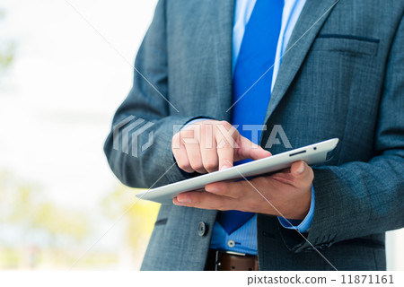 Businessman using tablet computer 11871161