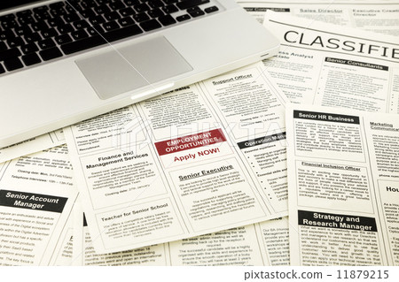 newspaper with advertisements and classifieds ads 11879215