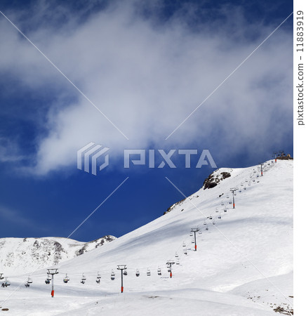 Chair-lift and ski slope in sun day Chair-lift and ski slope in sun day 11883919
