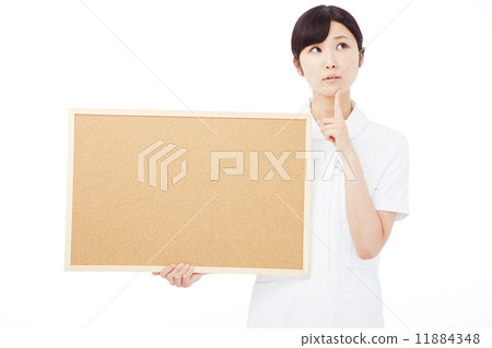 Nurse thinking with a message board Nurse thinking with a message board 11884348