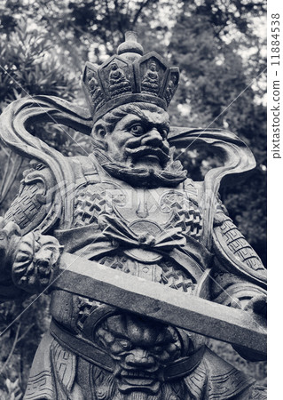 Aged asian god statue 11884538