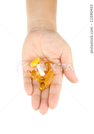 Vitamin in woman's hand Vitamin in woman's hand 11890493