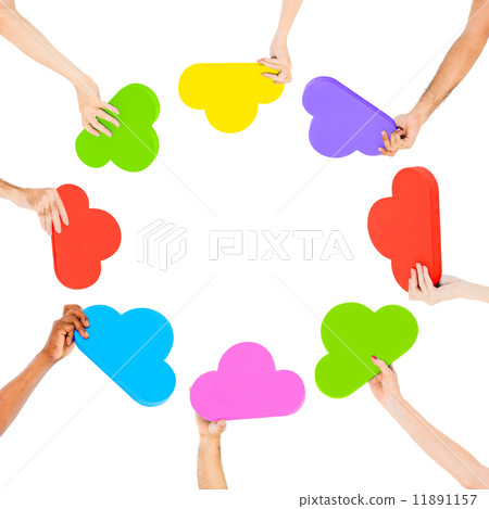 Hands holding multi colored cloud shaped speech bubbles Hands holding multi colored cloud shaped speech bubbles 11891157