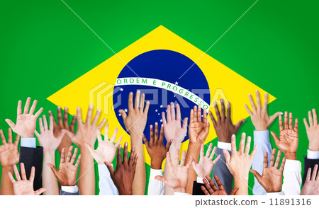 Group of Multi-Ethnic Arms Raised and a Flag of Brazil as a Back Group of Multi-Ethnic Arms Raised and a Flag of Brazil as a Back 11891316