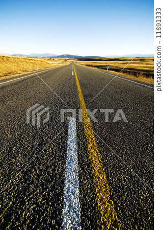 Continuous Road in a Scenic with Mountain Ranges Afar 11891333