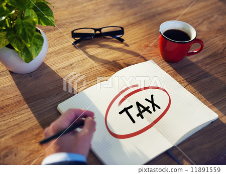 Businessman Writing the Word "Tax" Businessman Writing the Word "Tax" 11891559