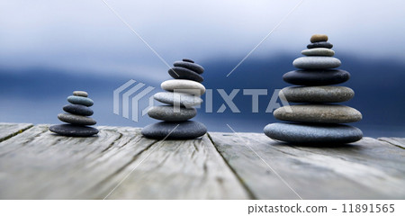 Zen Balancing Pebbles Next to a Misty Lake 11891565