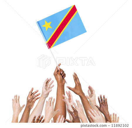 Group Of Multi-Ethnic People Reaching For And Holding The Flag O 11892102