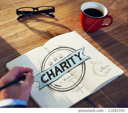 Businessman's table with Charity Concept Businessman's table with Charity Concept 11892395