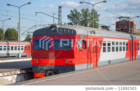 Modern red suburban electric train standing at the station in Ru Modern red suburban electric train standing at the station in Ru 11892503