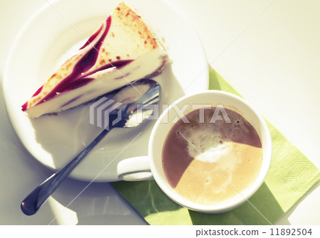 Cup of cappuccino coffee and cheesecake, vintage toned photo 11892504