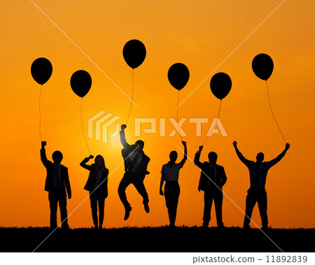 Business People Jumping While Holding Balloons Business People Jumping While Holding Balloons 11892839