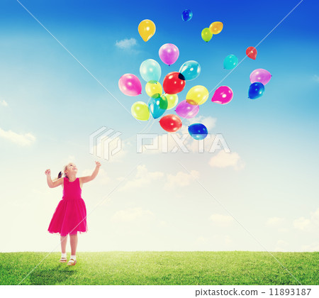 Little Girl Playing with Balloons Outdoors 11893187
