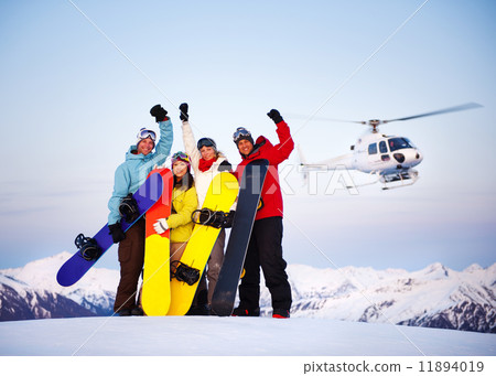 Snowboarders on Top of the Mountain with Heli Ski Snowboarders on Top of the Mountain with Heli Ski 11894019