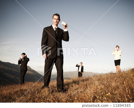 Business People Communicate Through The Paper Cup Phone Outdoors 11894385