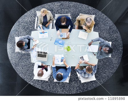 Multiethnic Group of People Discussing Statitiscal Analysis Multiethnic Group of People Discussing Statitiscal Analysis 11895898