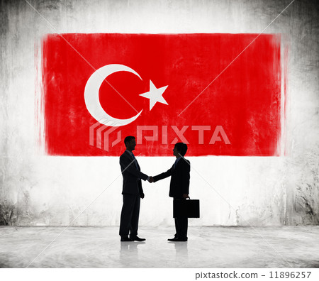 Two Businessmen Shaking Hands With Turkish Flag As A Background Two Businessmen Shaking Hands With Turkish Flag As A Background 11896257