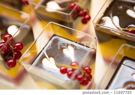 Layered dessert with fruits, nuts and cream cheese in glass jar Layered dessert with fruits, nuts and cream cheese in glass jar 11897785