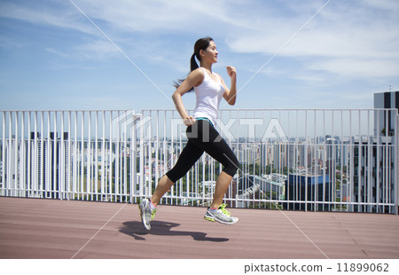 Asian woman running 11899062