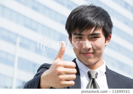 Asian businessman thumbs up 11899581