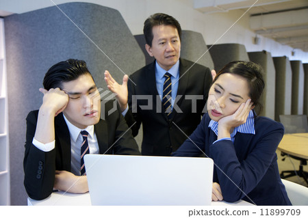 Frustrated Asian boss scolding his employees over work Frustrated Asian boss scolding his employees over work 11899709