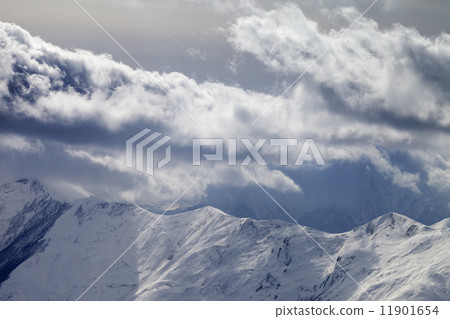 Evening mountains and cloudy sky 11901654